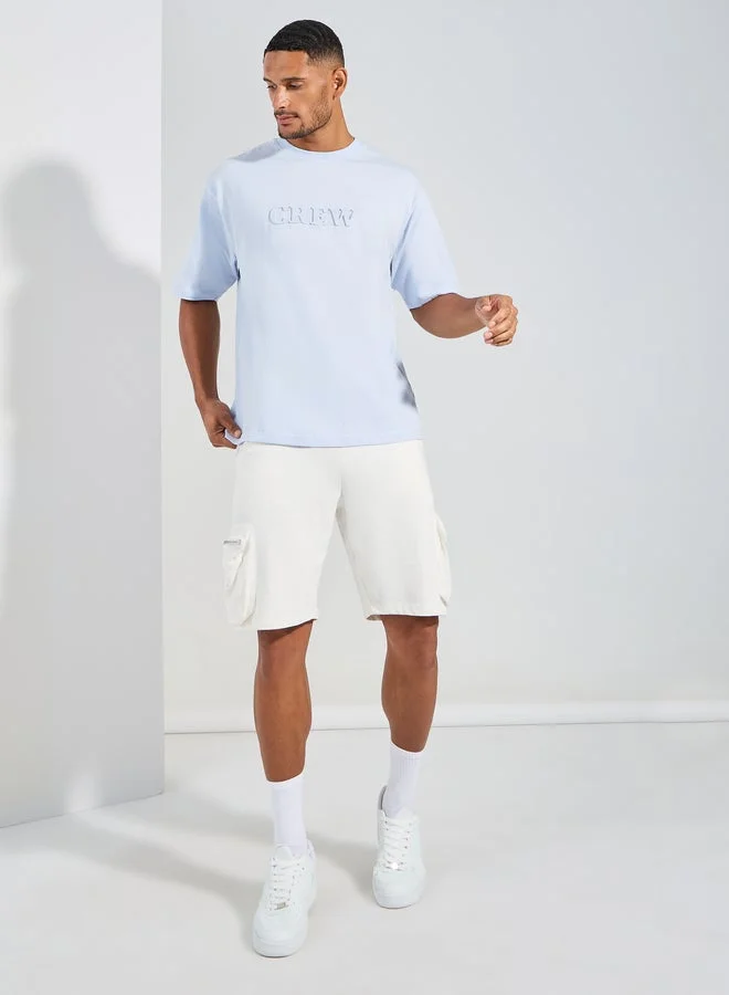 ستايلي تيشيرت جيرسي واسع مطبوع بشعار ستايلي